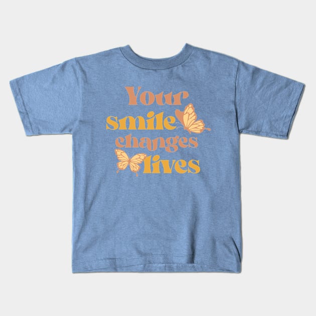 your smile changes lives Kids T-Shirt by WOAT